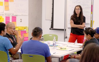 University of Colorado researcher Colleen Strawhacker teaching students archaeological excavation techniques in the Mimbres region of southern New Mexico.